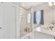 Bathroom featuring double sinks, a walk-in shower with glass door, and modern fixtures at 7068 Lanier Falls Rd, Deland, FL 32724