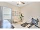 Bedroom featuring exercise equipment, neutral carpet, and a large window at 7068 Lanier Falls Rd, Deland, FL 32724