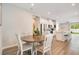 Bright dining area leading to the open-concept kitchen, great for gatherings at 7068 Lanier Falls Rd, Deland, FL 32724