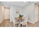 Cozy dining area featuring a charming round table and wood-style luxury vinyl plank floors at 7068 Lanier Falls Rd, Deland, FL 32724