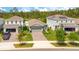 Charming single-Gathering home with well-manicured front yard, and a two-car garage at 7068 Lanier Falls Rd, Deland, FL 32724