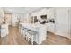 Spacious kitchen featuring a center island with bar stool seating and stainless steel appliances at 7068 Lanier Falls Rd, Deland, FL 32724