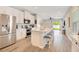 Bright kitchen featuring stainless appliances, a center island, and bar stool seating at 7068 Lanier Falls Rd, Deland, FL 32724