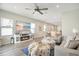 Spacious living room with luxury vinyl plank flooring and entertainment center with fireplace at 7068 Lanier Falls Rd, Deland, FL 32724