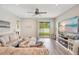 Inviting living room features light gray walls and luxury vinyl plank flooring at 7068 Lanier Falls Rd, Deland, FL 32724