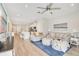 Open-concept living area with kitchen featuring luxury vinyl plank flooring at 7068 Lanier Falls Rd, Deland, FL 32724