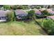 Aerial view featuring a home with a large yard, screened-in pool, mature trees, and landscaped surroundings at 716 Riviera Bella Dr, Debary, FL 32713