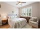 Bright and airy bedroom with a soft color palette and window with shutter at 716 Riviera Bella Dr, Debary, FL 32713