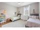 Bright ' bedroom with twin beds, a dresser, and stylish decor at 716 Riviera Bella Dr, Debary, FL 32713