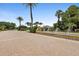 Gated community entrance with a fountain and meticulously landscaped surroundings at 716 Riviera Bella Dr, Debary, FL 32713