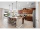 Open kitchen with granite countertops, stainless steel appliances, and a large island with seating at 716 Riviera Bella Dr, Debary, FL 32713