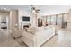 Inviting living room with a fireplace, modern furnishings, and an open view to the dining area at 716 Riviera Bella Dr, Debary, FL 32713