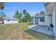 Lovely backyard with a charming patio, detached garage, and lush green grass at 717 S Ridgewood Ave, Ormond Beach, FL 32174