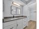 Updated bathroom with granite countertop, modern fixtures and access to the walk in closet at 717 S Ridgewood Ave, Ormond Beach, FL 32174