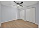 Bright bedroom with wood flooring, light grey walls, and ample closet space at 717 S Ridgewood Ave, Ormond Beach, FL 32174
