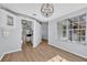 Inviting dining room with wood floors and views into the kitchen area at 717 S Ridgewood Ave, Ormond Beach, FL 32174
