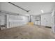Spacious garage offering ample storage cabinets, utility connections, and concrete flooring at 717 S Ridgewood Ave, Ormond Beach, FL 32174