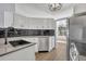 Bright kitchen with white cabinets, black subway tile backsplash, and stainless steel appliances at 717 S Ridgewood Ave, Ormond Beach, FL 32174