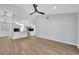 Open-concept living room with light wood floors, high ceilings, and neutral gray paint at 717 S Ridgewood Ave, Ormond Beach, FL 32174