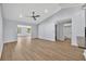 Open living space with light wood floors, neutral color palette, flowing seamlessly into other rooms at 717 S Ridgewood Ave, Ormond Beach, FL 32174