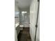 Cozy bathroom with a shower-tub combination, modern fixtures, and white cabinets at 736 S Stone St, Deland, FL 32720