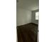 Bedroom featuring wood flooring, neutral walls, and a closet with bi-fold doors at 736 S Stone St, Deland, FL 32720