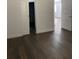 Bedroom features wood floors and a view into another bedroom and the closet at 736 S Stone St, Deland, FL 32720