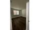 Bedroom featuring wood floors and a large window providing natural light at 736 S Stone St, Deland, FL 32720