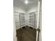 Walk-in closet with built-in shelving and rods for organization at 736 S Stone St, Deland, FL 32720