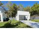 Modern home with a covered carport, well-manicured lawn, and tasteful landscaping at 736 S Stone St, Deland, FL 32720