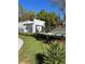 Charming home with a covered entrance, well-kept lawn, and new landscaping at 736 S Stone St, Deland, FL 32720