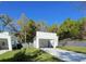 Stylish home featuring a covered parking, modern design, and a well-maintained lawn at 736 S Stone St, Deland, FL 32720