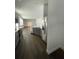 Bright, open kitchen with stainless steel appliances, eat-in island and hardwood floors at 736 S Stone St, Deland, FL 32720