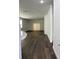 Spacious living room has wood-look flooring and sliding doors to the backyard at 736 S Stone St, Deland, FL 32720