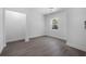 Bedroom featuring wood-look flooring, a window, and closet at 742 S Martin Luther King Blvd, Daytona Beach, FL 32114