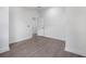 Neutral bedroom offers wood-look floors, white trim, and access to the bathroom at 742 S Martin Luther King Blvd, Daytona Beach, FL 32114