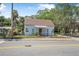 Charming one-story home showcasing light blue siding, brown trim, fenced yard, and welcoming front porch at 742 S Martin Luther King Blvd, Daytona Beach, FL 32114