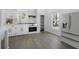 Modern kitchen with white cabinets, marble countertops, and stainless steel appliances at 742 S Martin Luther King Blvd, Daytona Beach, FL 32114