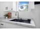 Modern kitchen with stainless steel sink and white marble countertops at 742 S Martin Luther King Blvd, Daytona Beach, FL 32114