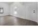 Bright living room featuring laminate flooring, fresh paint and natural light at 742 S Martin Luther King Blvd, Daytona Beach, FL 32114