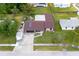 Aerial view of a well-maintained home showcasing its neat landscaping, fully fenced backyard and ample parking at 792 Bennett Rd, South Daytona, FL 32119