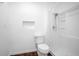 Bathroom featuring a shower, toilet, and a small window at 792 Bennett Rd, South Daytona, FL 32119