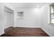 Bedroom with wood floors, neutral paint, and closet space at 792 Bennett Rd, South Daytona, FL 32119