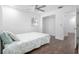 Bedroom with wood floors, ceiling fan, and closet space at 792 Bennett Rd, South Daytona, FL 32119