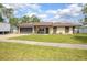 Charming single-story home with a well-maintained lawn and an inviting front porch at 792 Bennett Rd, South Daytona, FL 32119