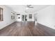 Open-concept living room featuring hardwood floors, ceiling fans and natural light at 792 Bennett Rd, South Daytona, FL 32119