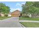 Beautiful home with a well-maintained lawn and a wide driveway at 859 Oak Hollow Loop, Deland, FL 32724