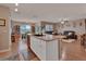 Open floor plan showcasing the kitchen island connecting living room and dining area for easy living at 859 Oak Hollow Loop, Deland, FL 32724