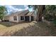 Exterior view of the back of the house with view of the back and side yard at 913 Lake Lindley N Dr, Deland, FL 32724