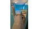 Bright bathroom with a walk-in shower, soaker tub, double sink vanity, and blue walls at 913 Lake Lindley N Dr, Deland, FL 32724